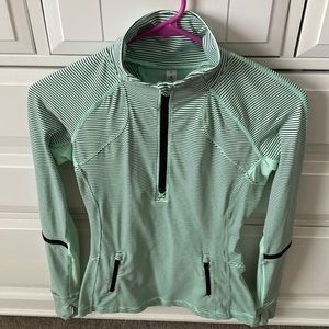 Lululemon half zip , mint green & black , never worn , unique pattern .